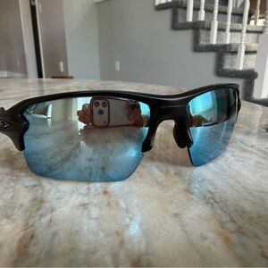 Oakley Half-Rim Sunglasses with Blue Mirrored Lenses